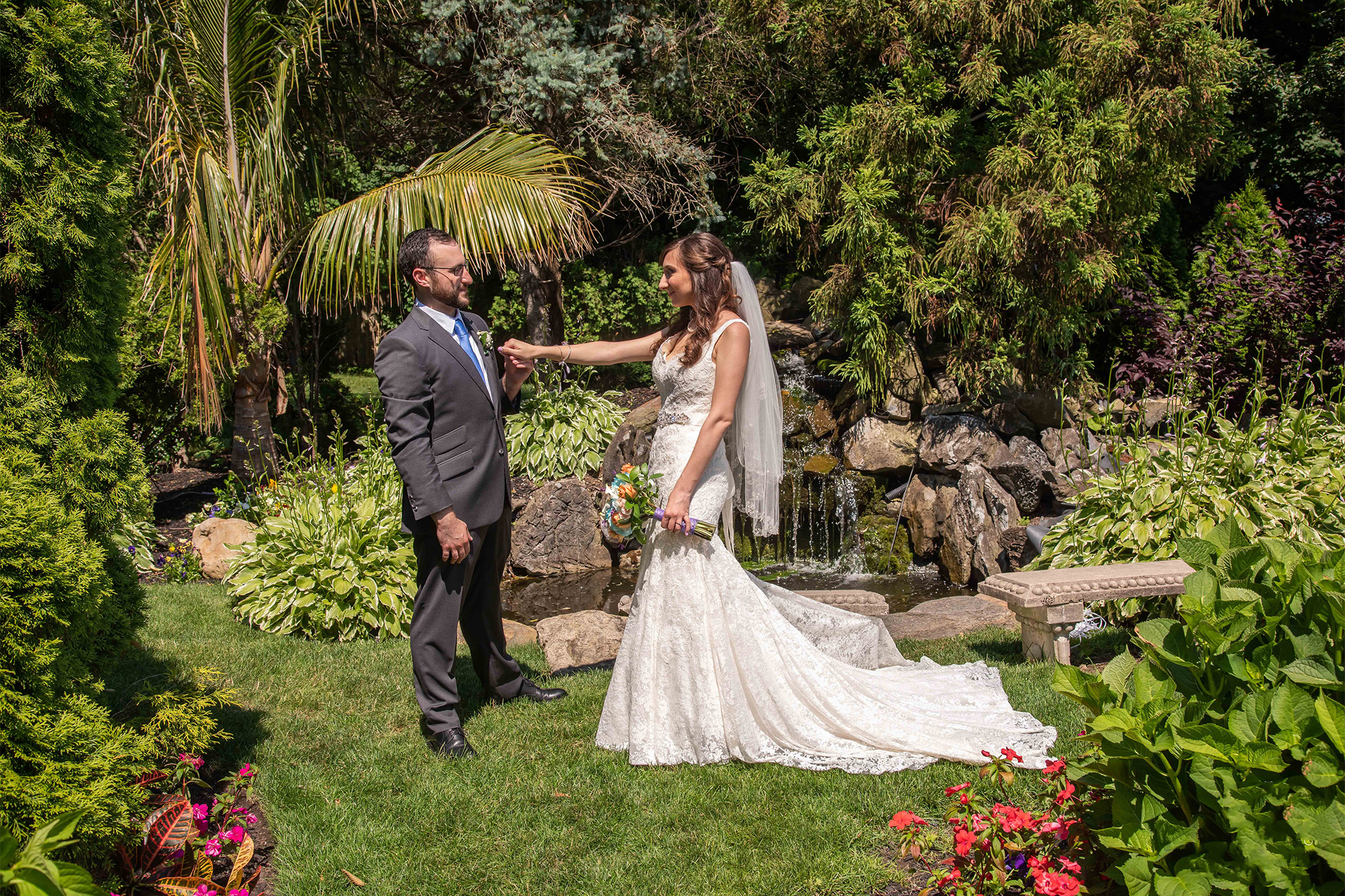 Couple in front of waterfall at Beach Club Estate